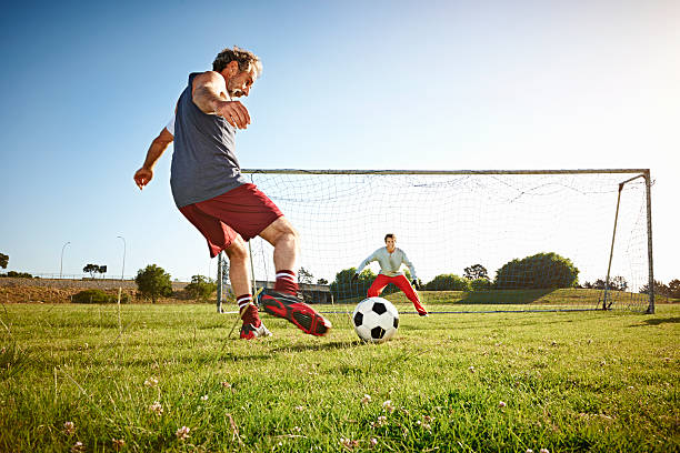 football players in action on the field, demonstrating their strong bodily-kinaesthetic intelligence as they expertly control the ball and execute precise movements